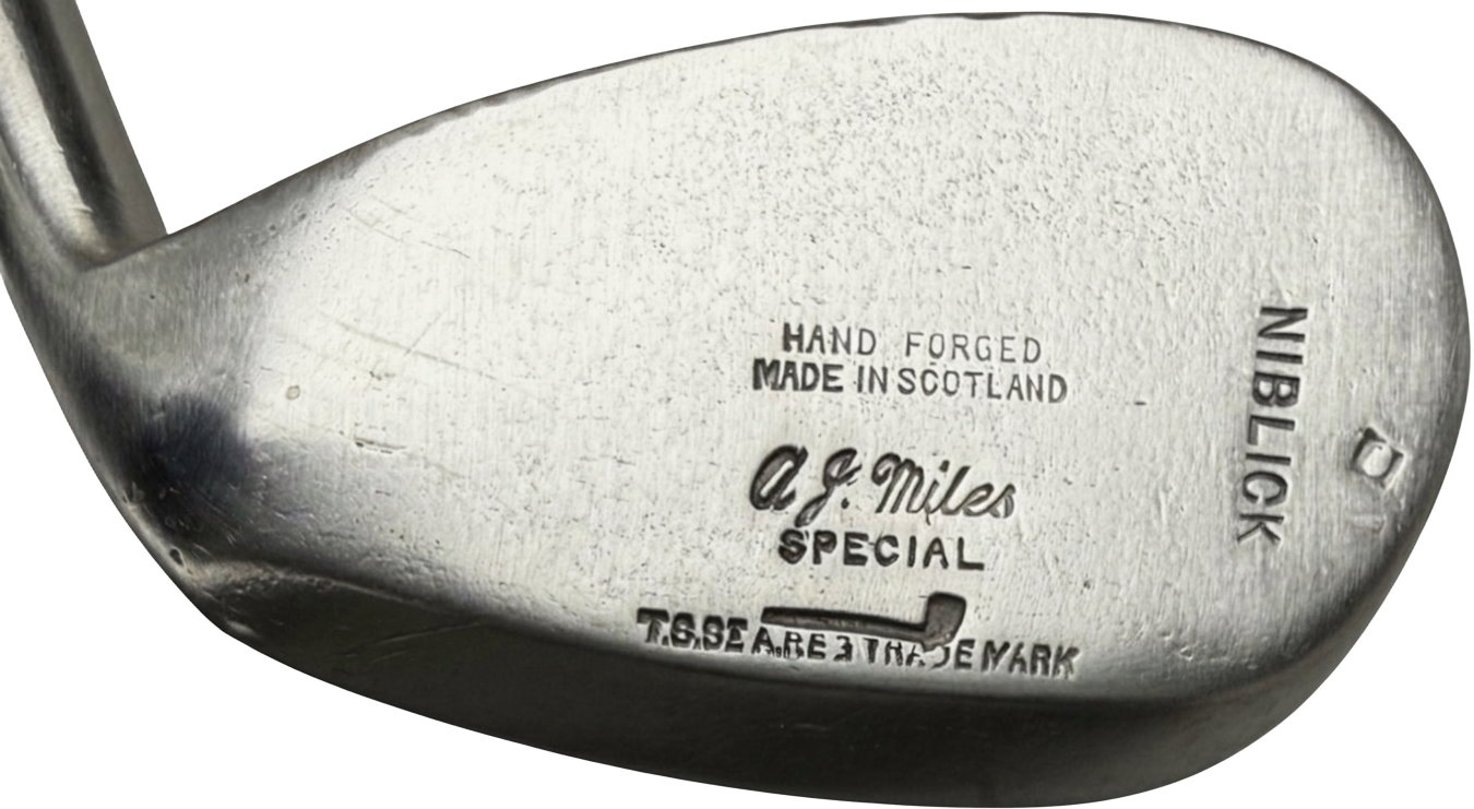 A. J. Miles Special retailer stamp above the Stewart pipe mark on a niblick head