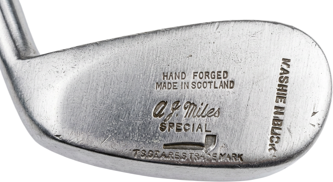 A. J. Miles Special retailer stamp above the Stewart pipe mark on a mashie niblick head