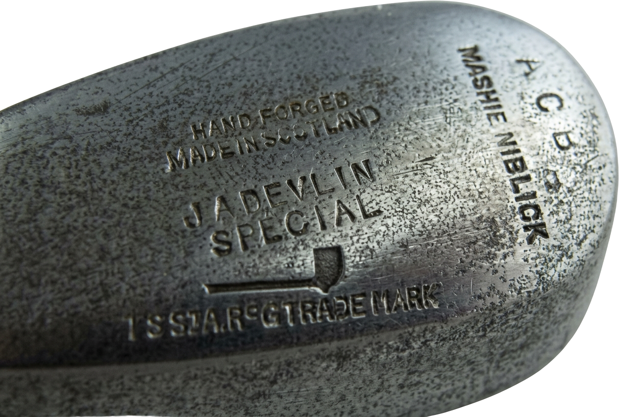 Pipe mark struck low on the back of a c. 1910 mashie niblick beneath J. A. Devlin Special lettering