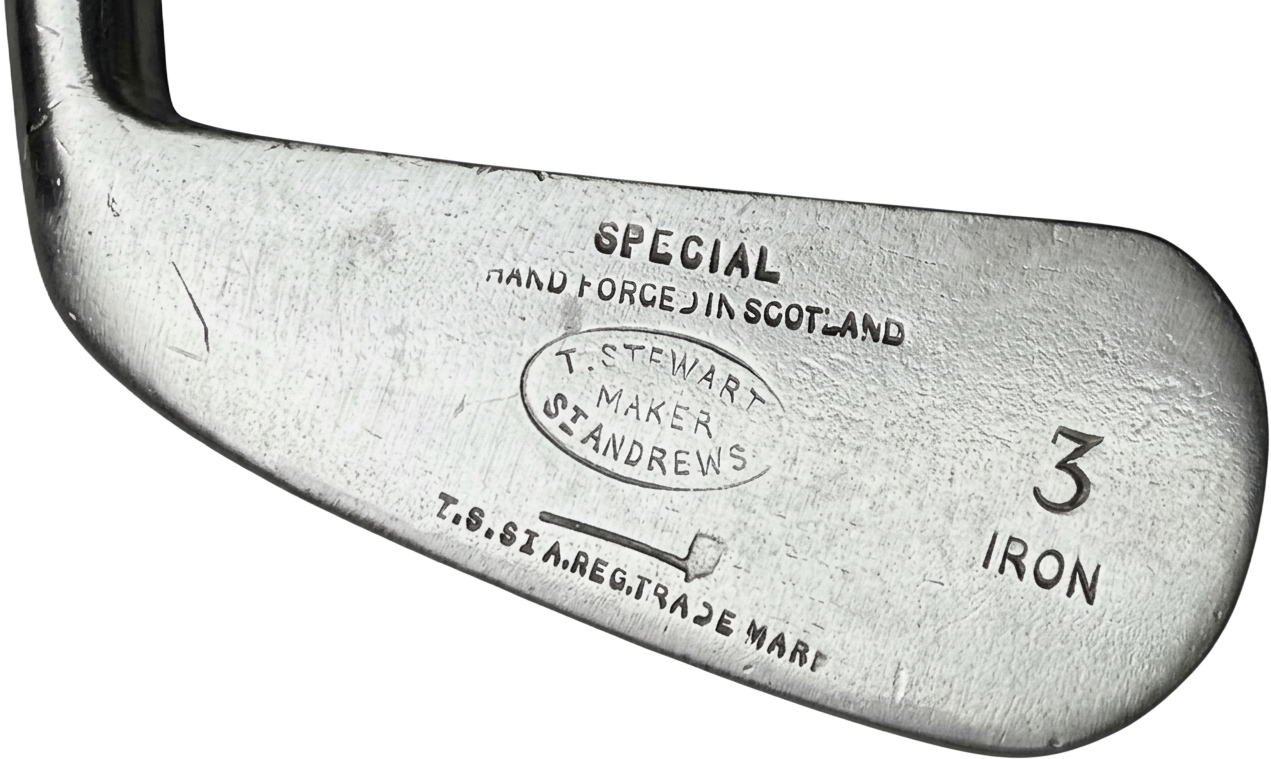 Oval T. Stewart Maker St Andrews stamp above the pipe mark on a 3 iron head